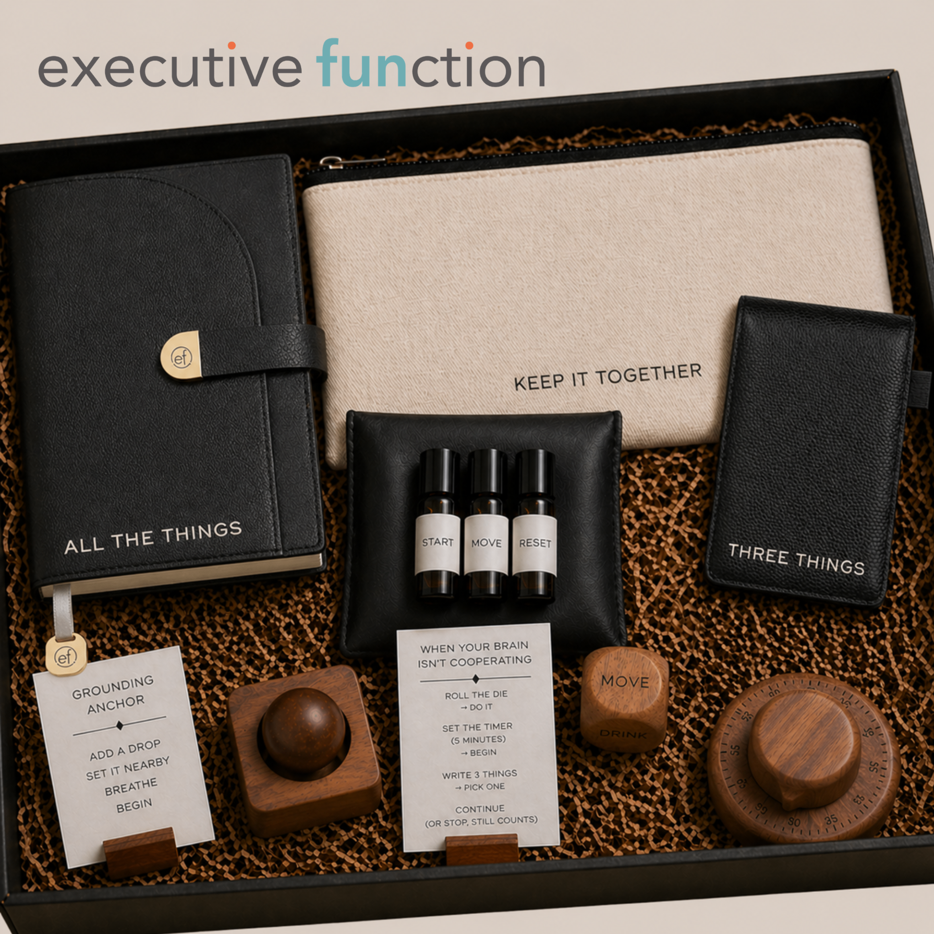 The Executive FUNction All the Things journal and open A7 flip notebook on a cream linen surface with a woman's hand wearing a delicate gold ring resting beside them